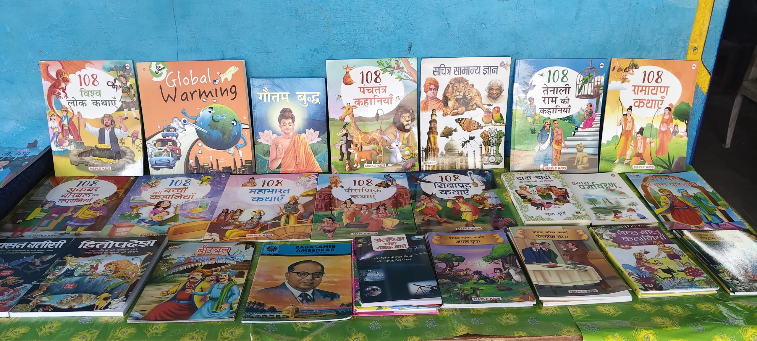 A collection of children's storybooks and educational books displayed at the SSF Library in P.S. Police Lines, Jaunpur.